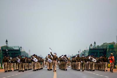 Police personnel take part in a rehearsal for the upcoming Republic Day Parade near India Gate in New Delhi. AFP