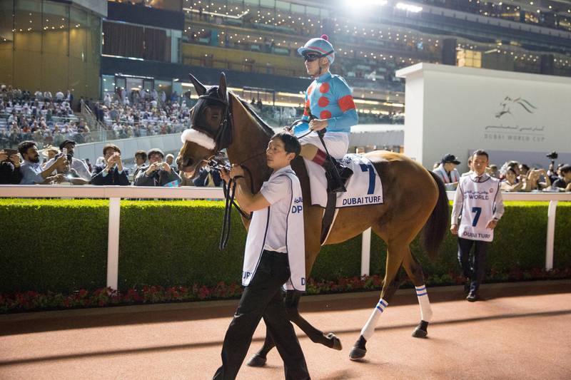 DUBAI, UNITED ARAB EMIRATES - MARCH 30: Christophe Lemaire riding Japanese horse Almond Eye during the Dubai Turf in the Dubai World Cup Day at Meydan Racecourse on March 30, 2019 in Dubai, United Arab Emirates. (Photo by Lo Chun Kit /Getty Images)