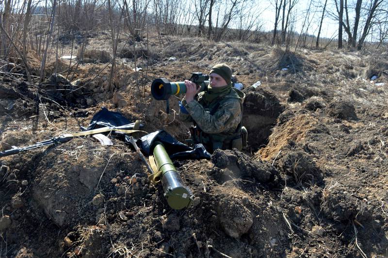 A Ukrainian serviceman with an FGM-148 Javelin, a US-made portable anti-tank missile, near Kharkiv on March 23, 2022.  AFP