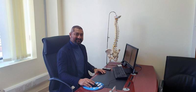 Dr George Varghese demonstrates the right way of sitting at a work station: with the spine straight, the small of the back well supported, ears over the shoulders, elbows by the sides and feet flat on the floor
