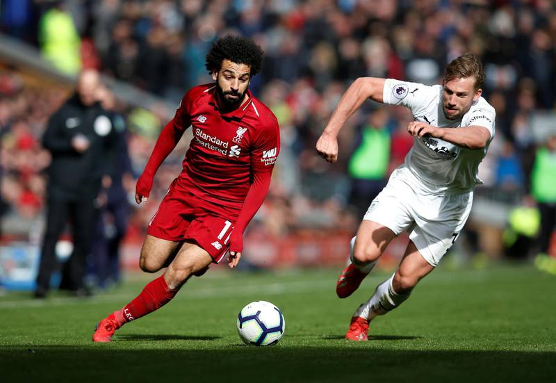 Liverpool's Mohamed Salah in action with Burnley's Charlie Taylor. Reuters