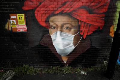 A mural by street artist Lionel Stanhope is seen on a bridge wall in Ladywell, south east London. AP Photo