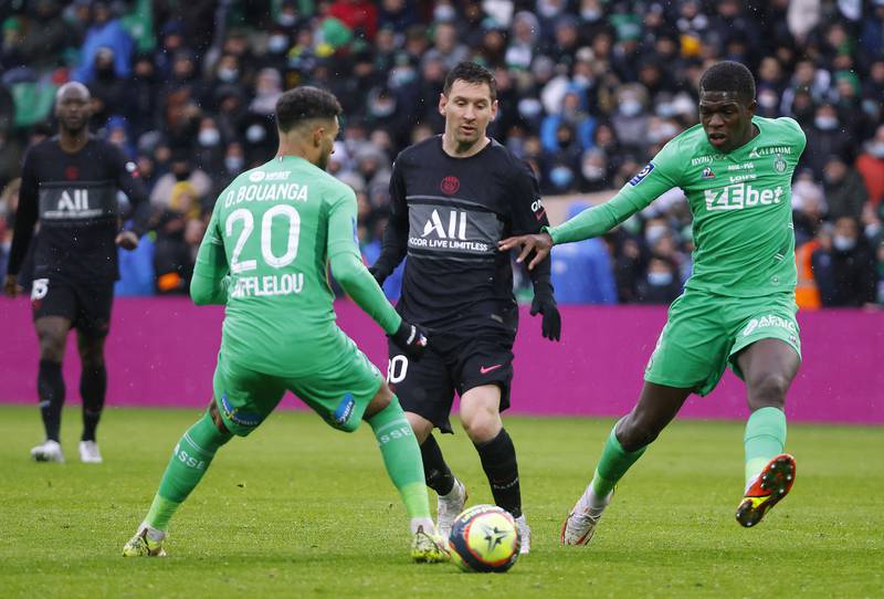 PSG's Lionel Messi in action with AS Saint-Etienne's Denis Bouanga. Reuters