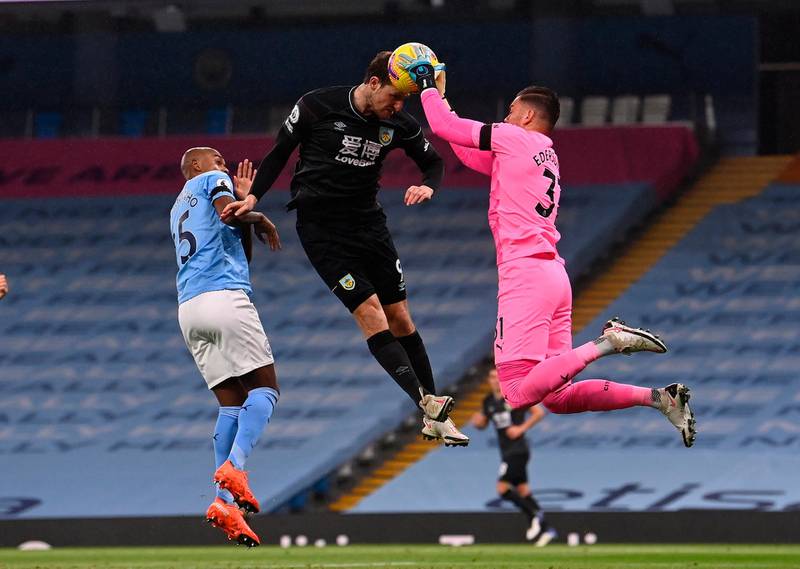 Manchester City goalkeeper Ederson saves a header from Burnley's Chris Wood. EPA