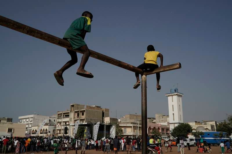 Senegal fans try to get the best view as they watch their team take on Ecuador, from a fan zone in Dakar. AP Photo