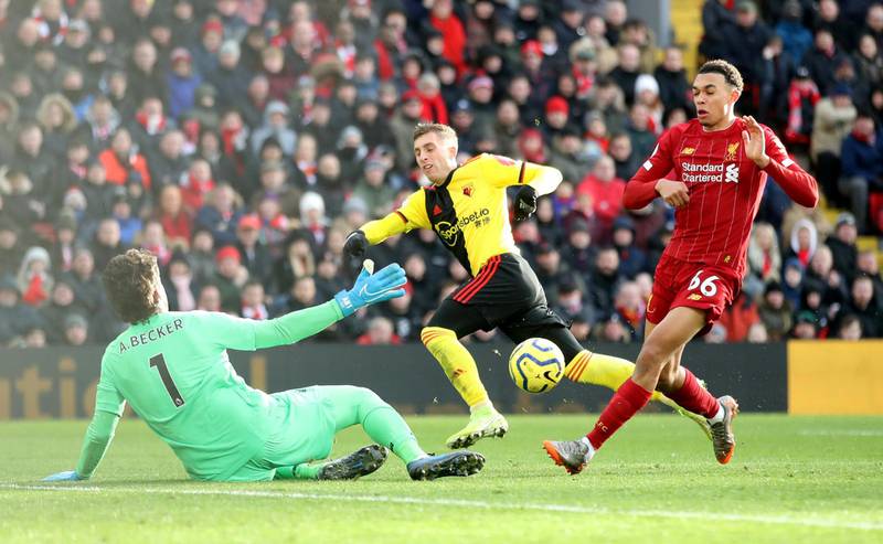 Liverpool's Alisson saves a shot from Watford's Gerard Deulofeu. Reuters
