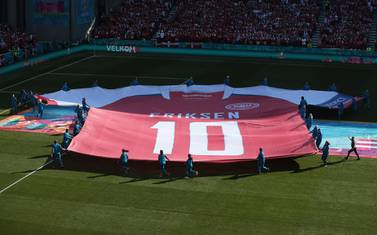 A giant jersey of Denmark's midfielder Christian Eriksen is put on display on the pitch before the start of the UEFA EURO 2020 Group B football match between Denmark and Belgium at the Parken Stadium in Copenhagen on June 17, 2021. / AFP / POOL / HANNAH MCKAY