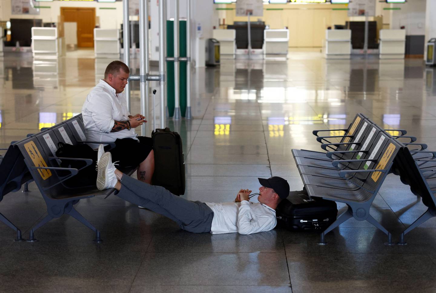 Tourists wait at Malaga-Costa del Sol Airport in Spain, from which a number of flights have been cancelled. Reuters