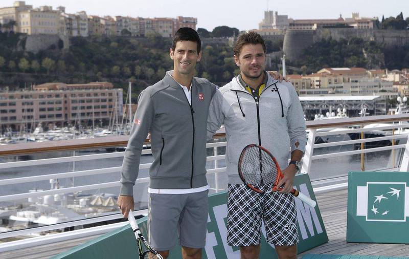 Novak Djokovic, left, and Stan Wawrinka, pose for photos at the Monaco yacht club ahead of the Monte Carlo Masters. Lionel Cironneau / AP Photo