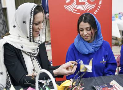 The Princess of Wales meets Dila Kaya, 14, one of two schoolgirls who made hundreds of origami cranes to raise funds for the Turkey-Syria Earthquake Appeal, on a visit to London's Hayes Muslim Centre. PA