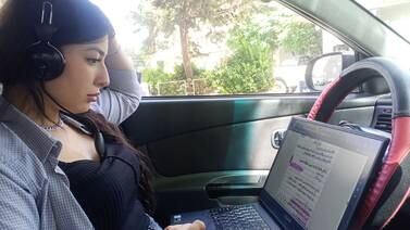 Jawahir Fakhro spends hours in her car every week, recording texts requested by blind students, as part of her volunteering in Read With My Eyes initiative. Image by Safaa Sallal