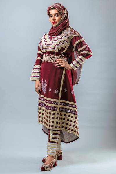 This outfit is worn in Taif ( a mountainous area south of Makkah) especially in Al Hada, Al Shifa and Wadi Mehrem. It has a pair of trousers beneath it and the dress is actually long/ full length but it is folded and then held in place by a belt, to show the trousers and for easy walking as it is for a mountain area. Hussain Haddad for The National.  