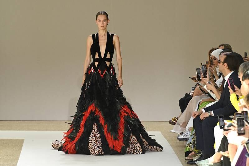 Opening the Elie Saab autumn-winter haute couture 2022-23 show was this cutaway dress covered in black and red feathers. Getty