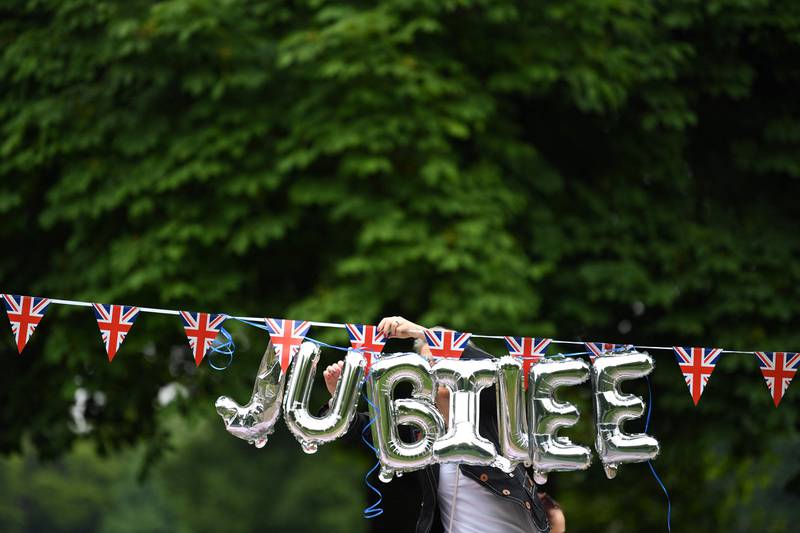 Balloons are hung ahead of the Big Jubilee Lunch on The Long Walk in Windsor. AFP
