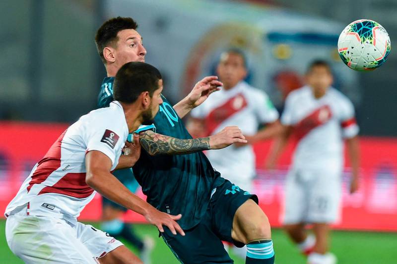 Peru's Miguel Trauco, left, and Argentina's Lionel Messi vie for the ball. AFP