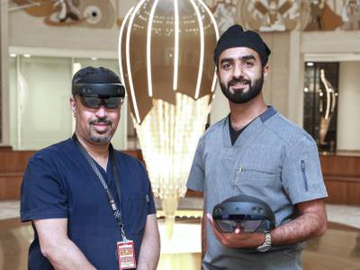 Abu Dhabi, United Arab Emirates, February 3, 2021.  Surgeons are trying out new holographic surgery technology.  (L-R) Dr. Rashed Al Shaeel, Consultant- Head of Orthopedics and Trauma at Burjeel Medical City and Dr. Jaber AlKhyeli, Consultant Orthopedic Surgeon at Burjeel Medical City with the HoloLens 2 mixed reality headset.Victor Besa/The National.Section:  NAReporter:  Nick Webster