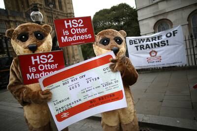Protesters dressed as otters demonstrate against HS2 near Parliament in London in November 2013. Getty Images
