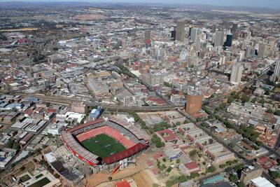 JOHANNESBURG, SOUTH AFRICA - AUGUST 31:  The city skyline rises beyond Ellis Park Stadium, one of the venues for the 2010 Fifa World Cup, on August 31, 2008 in Johannesburg, South Africa.  (Photo by David Rogers/Getty Images)