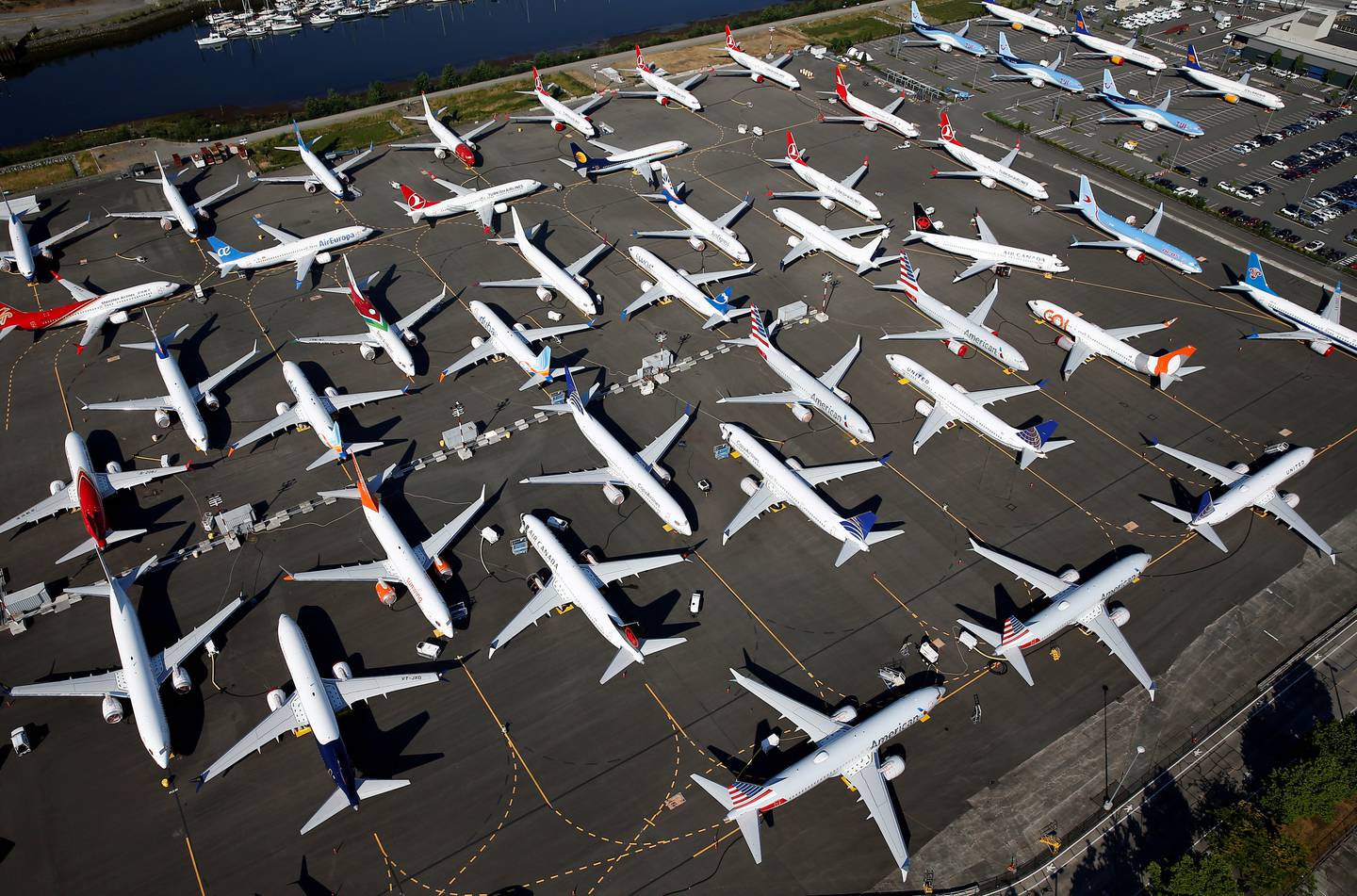 FILE PHOTO: Dozens of grounded Boeing 737 MAX aircraft are seen parked in an aerial photo at Boeing Field in Seattle, Washington, U.S. July 1, 2019. Picture taken July 1, 2019.  REUTERS/Lindsey Wasson/File Photo
