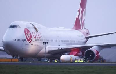 A Virgin Boeing 747-400 aircraft sits on the tarmac, with Virgin Orbit's LauncherOne rocket attached to the wing, ahead of the first UK launch at Newquay Airport in Britain in January. Reuters