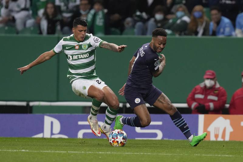 Sporting's Matheus Reis controls the ball as Manchester City's Raheem Sterling chases. AP 
