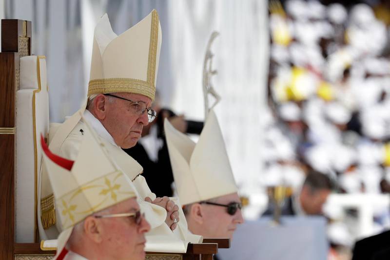 Pope Francis sits in front of the altar as he celebrates Mass. AP Photo