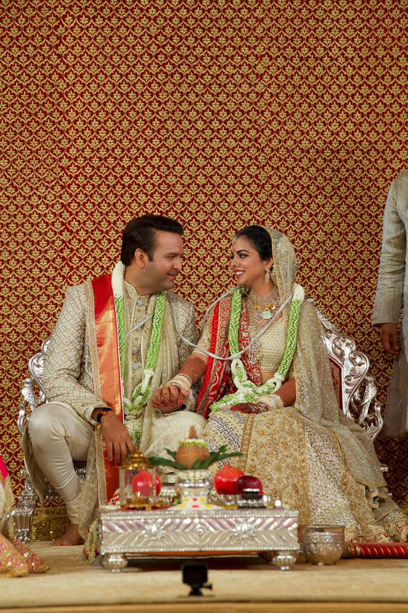 Bride Isha Ambani, the daughter of the Chairman of Reliance Industries Mukesh Ambani, and her groom Anand Piramal, heir to a real-estate and pharmaceutical business, after they got married in Mumbai, India, December 12, 2018. Reliance Industries/Handout via REUTERS  ATTENTION EDITORS - THIS IMAGE WAS PROVIDED BY A THIRD PARTY. NO RESALES. NO ARCHIVE.