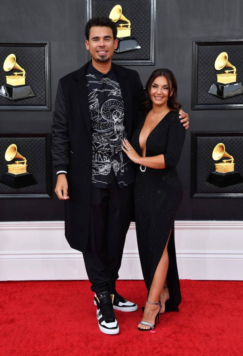 Afrojack, wearing black, with his wife, singer Elettra Lamborghini. AFP