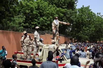 Security forces attempt to disperse pro-junta demonstrators gathered outside the French embassy in Niamey, the capital of Niger. Reuters