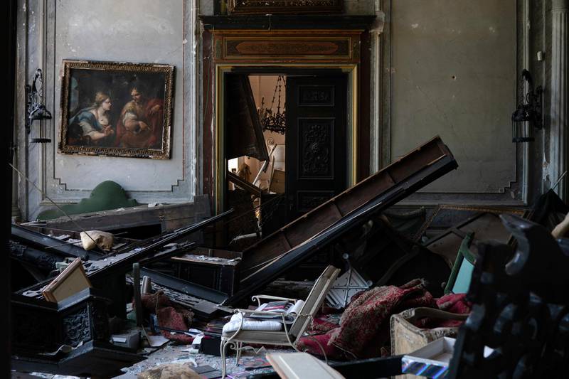 A painting hangs on the wall of a heavily damaged room in the Sursock Palace.  AP Photo