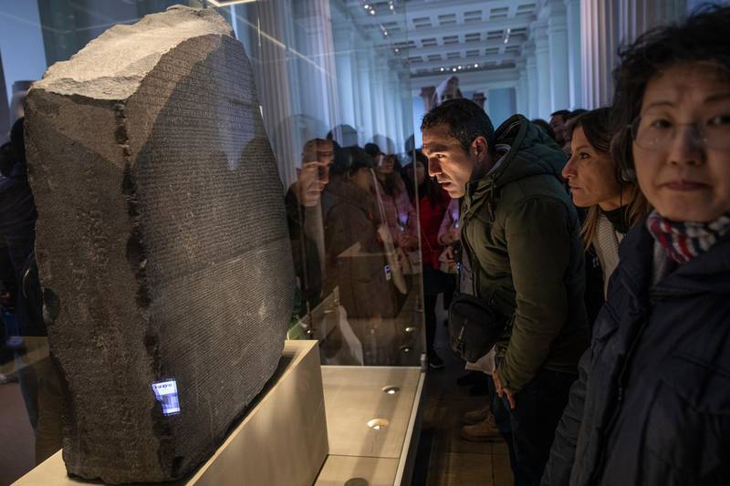 LONDON, ENGLAND - NOVEMBER 22: The Rosetta Stone is displayed at The British Museum on November 22, 2018 in London, England. The Rosetta Stone is one of the museums most important pieces playing a vital role in historians understanding hieroglyphics for the first time as they sit alongside Demotic and Ancient Greek scripts.  (Photo by Dan Kitwood/Getty Images)