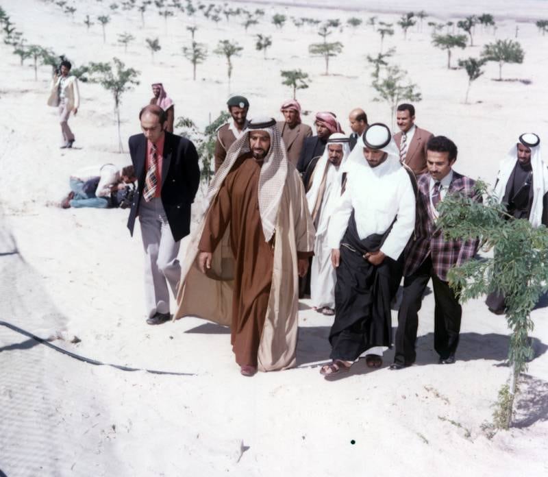 Sheikh Zayed Bin Sultan Al Nahyan inspecting villages along the Abu Dhabi/Al Ain Road, 1976 
National Archives images supplied by the Ministry of Presidential Affairs to mark the 50th anniverary of Sheikh Zayed Bin Sultan Al Nahyan becaming the Ruler of Abu Dhabi. *** Local Caption ***  35.jpg