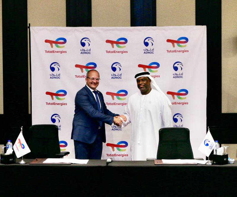 Bader Al Lamki, chief executive of Adnoc Distribution (right) and Thierry Pflimlin, president, Marketing & Services at TotalEnergies, sign the agreement for acquisition of 50 per cent of TotalEnergies Marketing Egypt. Photo: Adnoc