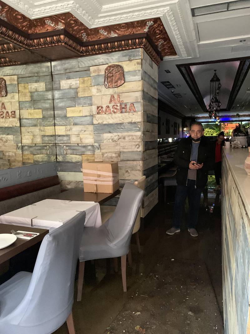 Magdy Khalil, owner of Al Basha, a popular Egyptian restaurant in Knightsbridge, pictured in the flooded venue. Photo: Laura O'Callaghan / The National