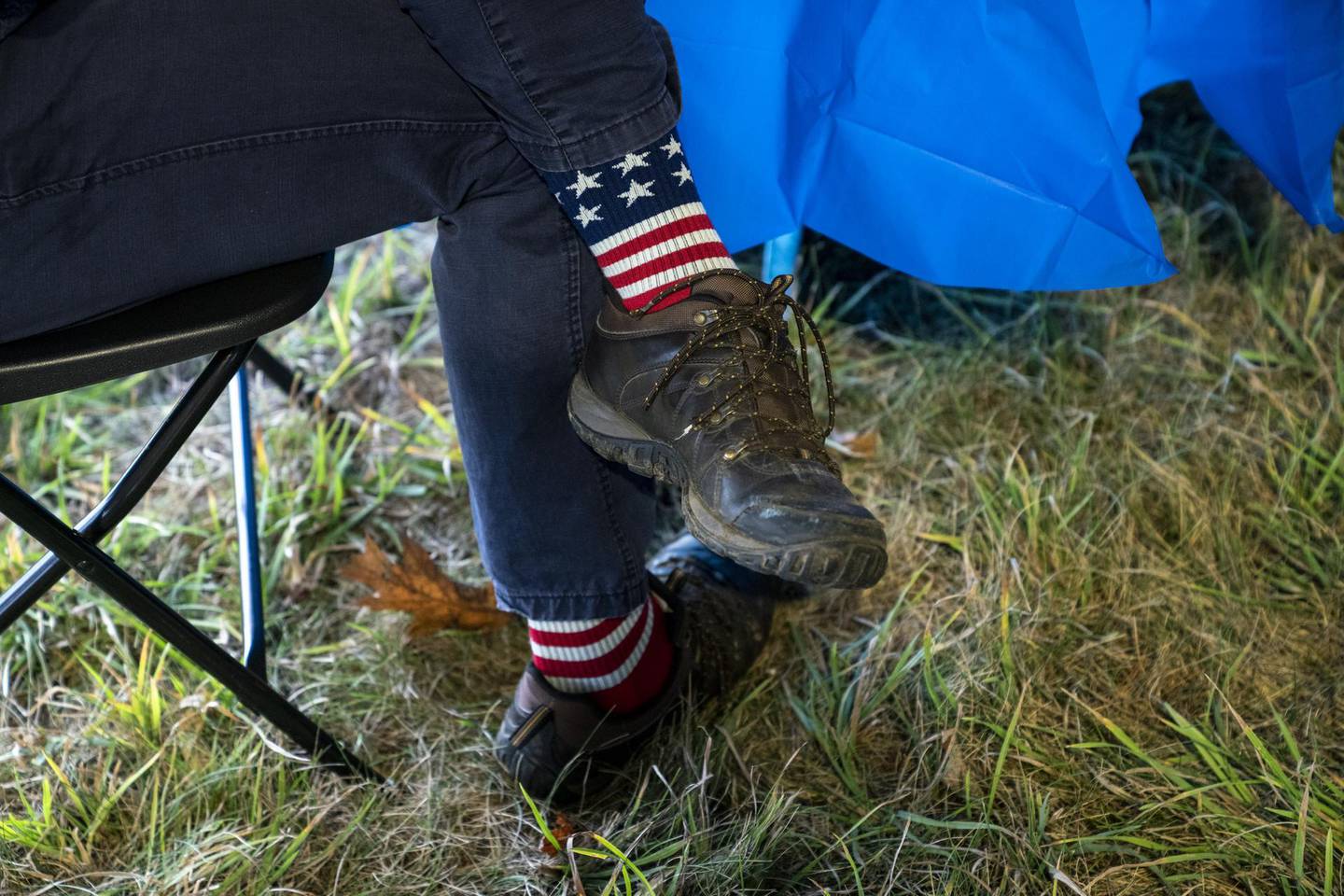 An attendee wears patriotic socks to a 'Supper with Sara' campaign event with U.S. Democratic Senate candidate Sara Gideon in Scarborough, Maine, U.S., on Tuesday, Oct. 20, 2020. The RealClearPolitics polling average shows Gideon with a 3.7 point lead over Republican Senator Susan Collins, who has represented Maine in the Senate since 1997. Photographer: Sarah Rice/Bloomberg