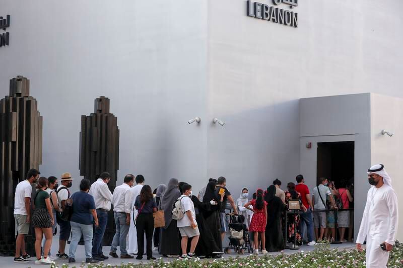 People wait to enter Lebanon's pavilion.