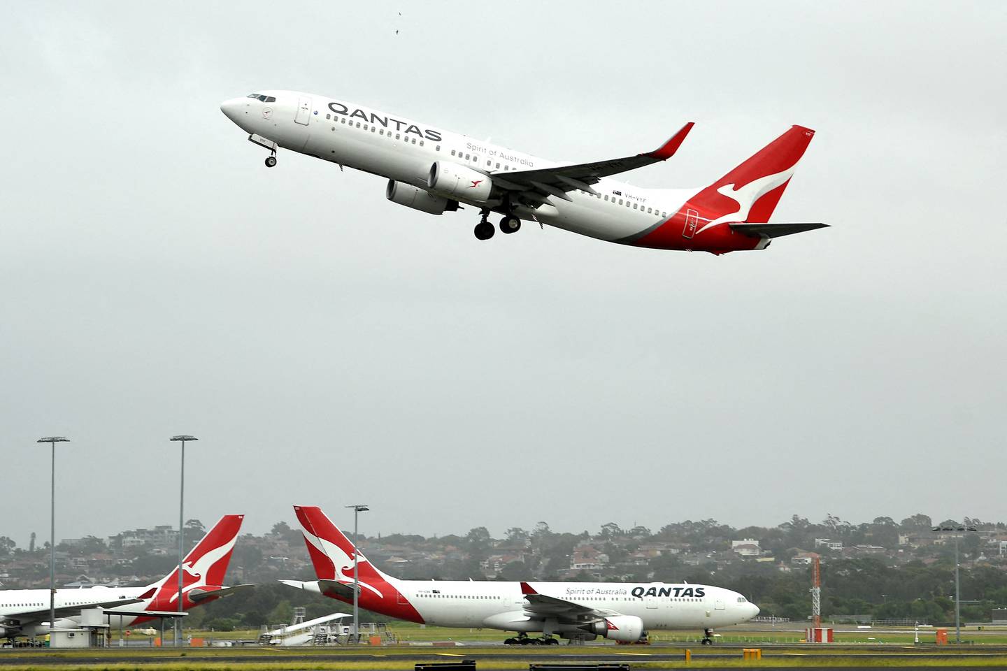 A Qantas passenger plane takes off from Sydney International Airport. AFP