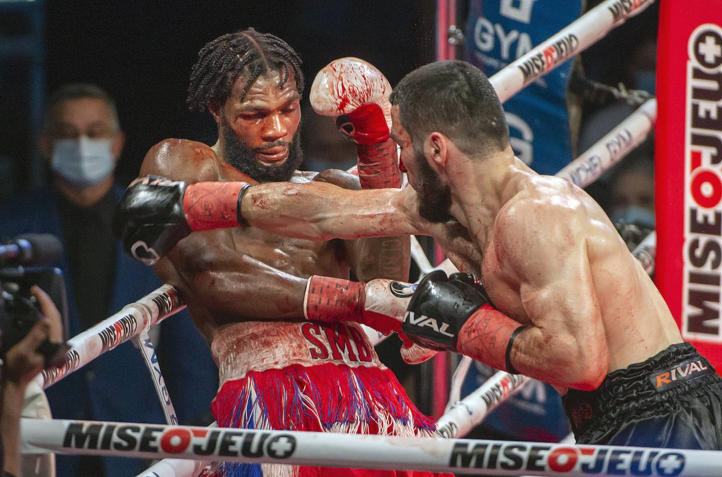 Artur Beterbiev, right, knocks out Marcus Browne to defend his WBC and IBF light-heavyweight titles. AP