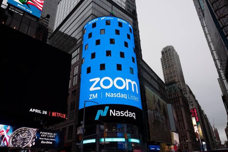 FILE - In this April 18, 2019, file photo shows a sign for Zoom Video Communications ahead Nasdaq IPO in New York. Zoom's stock touched $110 during trading Monday, Feb. 24, 2020, a level it's reached just once since its shares began trading last spring. The company has said it's seeing more business for people wanting to meet online. (AP Photo/Mark Lennihan, File)