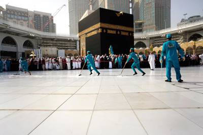 Workers sterilize the ground in front of the Kaaba in Makkah, Saudi Arabia. AP Photo