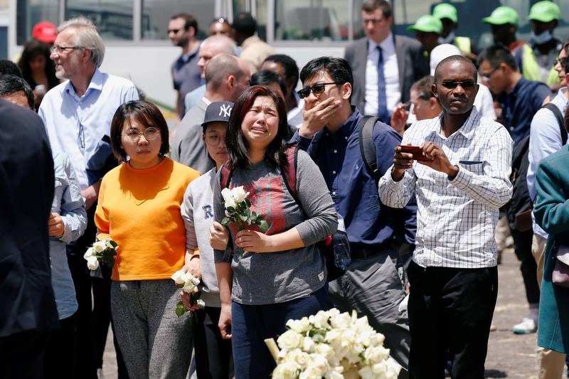 Chinese family and friends mourn victims of the Ethiopian Airlines Flight ET 302 plane crash during a commemoration ceremony at the scene of the crash. Reuters