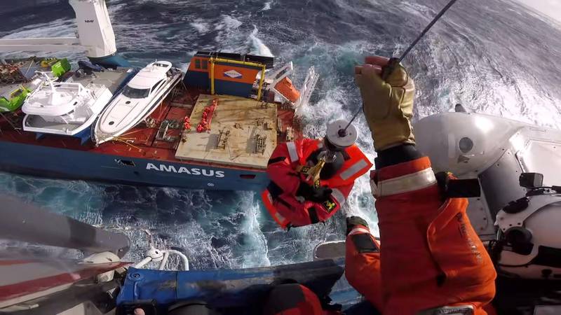 Head cam footage of a search and rescue member hoisting a crew member from Dutch cargo ship Eemslift Hendrika during an evacuation in stormy weather off the coast of Norway in the North Sea, April 5, 2021 in this still image obtained from social media video. Content filmed April 5, 2021. Joint Rescue and Coordination Centre (JRCC) South-Norway via REUTERS THIS IMAGE HAS BEEN SUPPLIED BY A THIRD PARTY. MANDATORY CREDIT. NO RESALES. NO ARCHIVES.