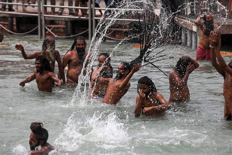 Naga Sadhus, or Hindu holy men, take a dip in the Ganges river during the second Shahi Snan at Kumbh Mela. Reuters
