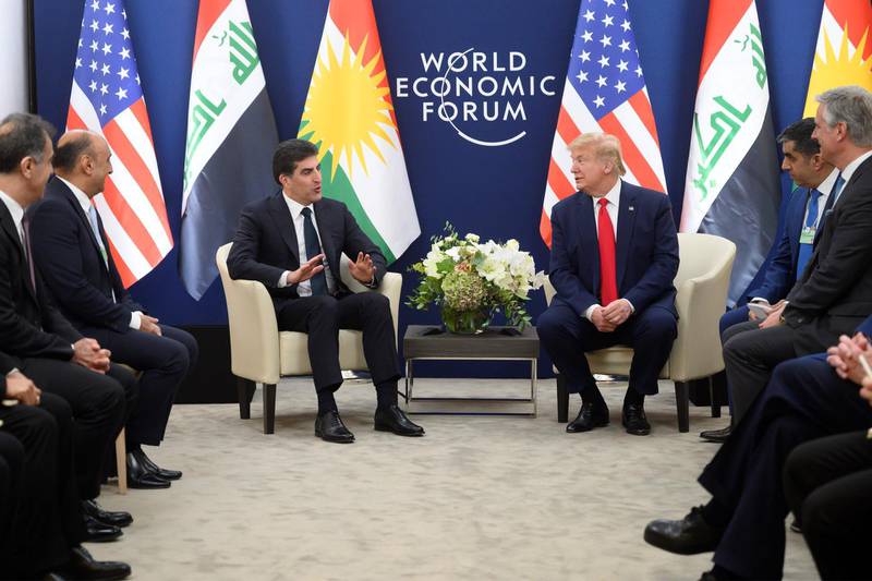 US President Donald Trump speaks with President of the Kurdistan Regional government (IKRG) Nechirvan Barzani during a meeting at the World Economic Forum in Davos.  AFP