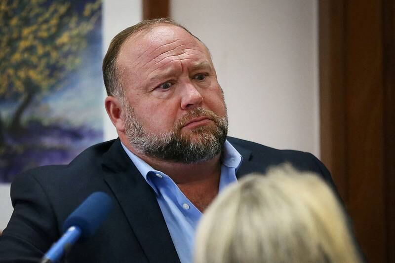 Alex Jones attempts to answer questions about his emails asked by Mark Bankston, lawyer for Neil Heslin and Scarlett Lewis, during a trial in Austin, Texas. Reuters