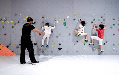 Abu Dhabi, United Arab Emirates, August 20, 2020.   Budding wall climbers scale the walls of Cymb Abu Dhabi with an instructor guiding the way.
Victor Besa /The National
Section:  NA
Reporter:  Jason Von Berg