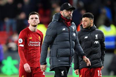Dejection for Jurgen Klopp, defender Andrew Robertson and midfielder Alex Oxlade-Chamberlain at the final whistle after their 3-0 defeat against Watford. AFP