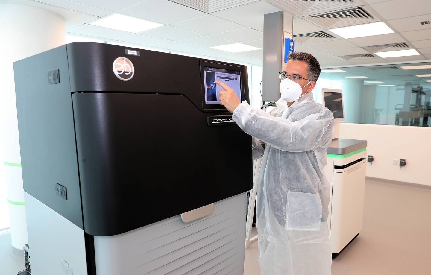 Andrea Riposati shows the sequencer machine in the Dante Labs at Silicon Oasis in Dubai. Pawan Singh / The National