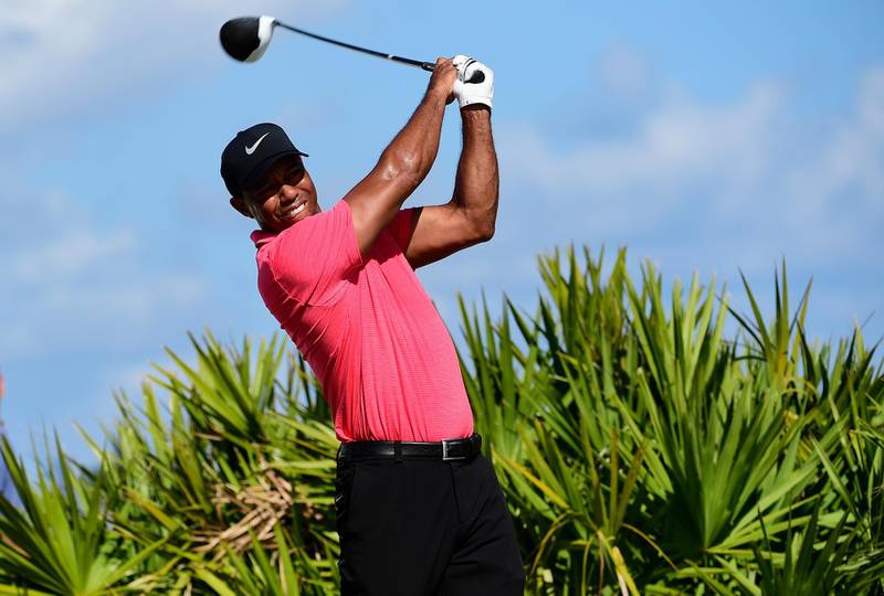 FILE - In this Dec. 3, 2017, file photo, Tiger Woods tees off on the third hole during the final round of the Hero World Challenge golf tournament at Albany Golf Club in Nassau, Bahamas. Woods is embarking on his latest comeback without a swing coach, saying he has worked hard to relearn his body and the golf swing.  (AP Photo/Dante Carrer, File)
