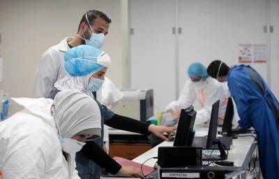 Medical staff members work in an intensive care unit for patients suffering from the coronavirus, at Rafik Hariri University Hospital, in Beirut, Lebanon. Reuters